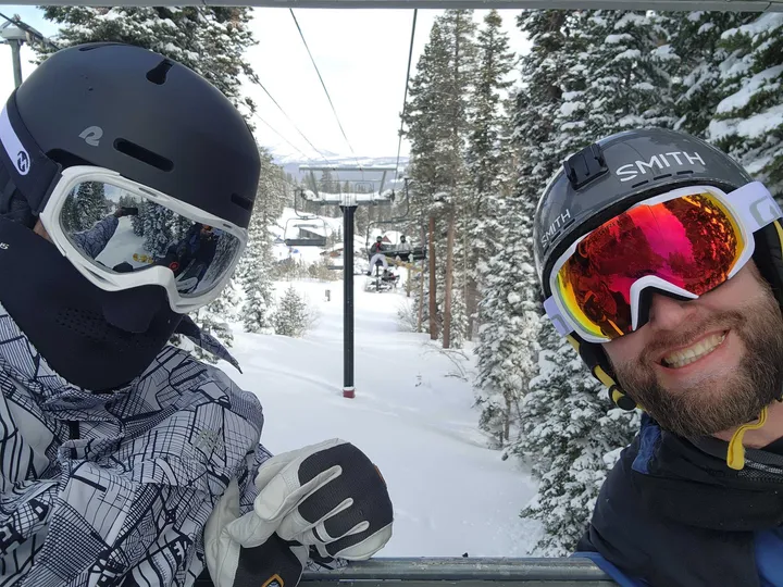 Two members of the Invisible AI team on a ski lift